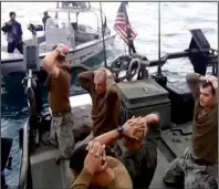  ?? AP/IRIB News Agency ?? U.S. sailors are shown being detained Tuesday in the Persian Gulf by Iranian Revolution­ary Guard forces in this frame grab from Iranian state-run IRIB news agency video.