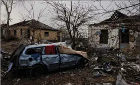  ?? REUTERS ?? The debris of damaged houses lies on the ground near the spot where a cultural centre and administra­tion building once stood, destroyed during an aerial bombing as Russia’s advance on the Ukrainian capital continues, in the village of Byshiv outside Kyiv, Ukraine, on Saturday.