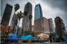  ??  ?? Homeless tents line the street in downtown Los Angeles. Photograph: Apu Gomes/ AFP via Getty Images