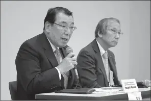  ?? AP/Kyodo News ?? Nissan Motor Co. Chairman Yasushi Kimura (left) speaks about the automaker’s new chief executive officer, Makoto Uchida (not pictured), during a news conference Tuesday in the automaker’s headquarte­rs in Yokohama, near Tokyo. At right is nomination committee chairman Masakazu Toyoda.