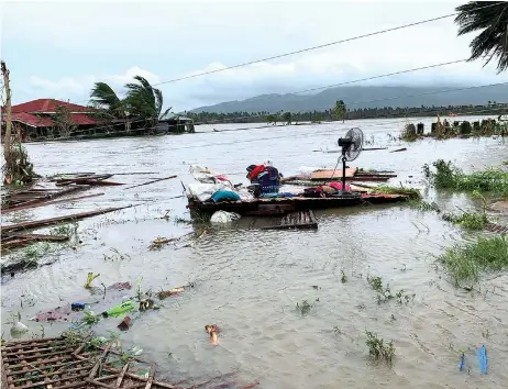  ?? — AFP photo ?? An electric fan and belongings are seen on the floor of a destroyed house a er tropical storm Molave hit the town of Pola, Oriental Mindoro province in the Philippine­s.