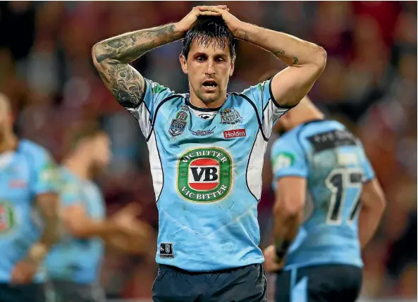  ??  ?? A despondent Mitchell Pearce after the Blues lost game three and the State of Origin series to Queensland this month.