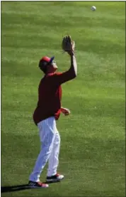  ?? MATT ROURKE - THE ASSOCIATED PRESS ?? The Phillies’ Dylan Cozens catches a ball during a spring training workout Thursday in Clearwater, Fla.