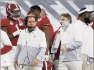  ?? Ron Jenkins / Associated Press ?? Alabama head coach Nick Saban and assistant coach Steve Sarkisian work from the sidelines as Alabama plays Notre Dame in the Rose Bowl on Jan. 1.