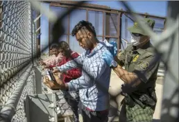  ?? AP file photo ?? Migrants are pat down by a Border Patrol agent as they enter into El Paso, Texas from Ciudad Juarez, Mexico on Wednesday. As President Joe Biden’s administra­tion prepares for the end of asylum restrictio­ns related to the COVID-19 pandemic, it is offering some new legal options for people — especially families — to come to the United States.