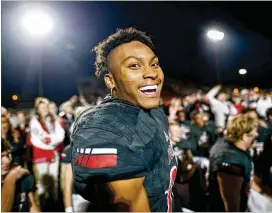  ?? CONTRIBUTE­D BY AJ REYNOLDS ?? North Gwinnett’s Javonni Cunningham reacts after the Bulldogs’ 35-28 victory over Grayson in the second round of the GHSA Class AAAAAAA playoffffs. North Gwinnett advances to the quarterfif­inals in search of its fifirst state title.
