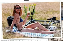  ?? ?? TAKE A BREAK: Cyclist sunbathes in Richmond