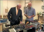  ?? NICHOLAS BUONANNO -- NBUONANNO@TROYRECORD.COM ?? U.S. Rep. Paul Tonko, left, looks over some of the work being done at Actasys in Watervliet on Tuesday with Actasys co-founder Dr. David Menicovich.