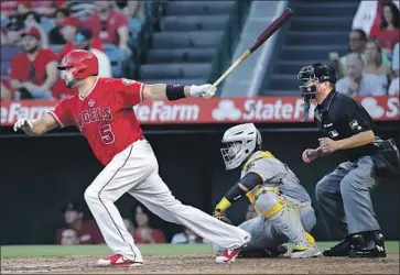  ?? Marcio Jose Sanchez Associated Press ?? THE ANGELS’ Albert Pujols singles in the fourth inning to move ahead of fellow Dominican Adrian Beltre as Major League Baseball’s all-time hits leader among foreign-born players. Pujols also had a single in the eighth.