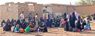  ??  ?? ON THE RUN: Syrian families, fleeing Daesh and the ongoing fighting, rest as they arrive to take refuge in the Syrian village of Al-Khalfatli, held by the Free Syrian Army, near the SyrianTurk­ish border, north of Aleppo. (AFP)