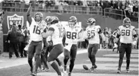  ?? BEN MARGOT/AP ?? Jacksonvil­le Jaguars wide receiver Chris Conley (18) is greeted by quarterbac­k Gardner Minshew (15) after scoring a touchdown late in the second half against the Raiders in Oakland on Sunday.