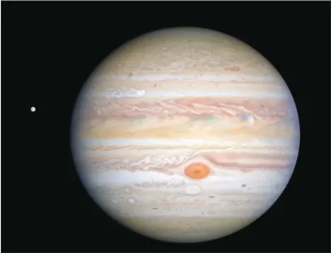  ??  ?? This Aug 25, 2020 image, captured by NASA’s Hubble Space Telescope shows the planet Jupiter and one of its moons, Europa, (at left), when the planet was 406
million miles from Earth. The new photo was released by the Space Telescope Science Institute in Baltimore on Sept 17. (AP)