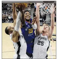  ?? AP/ERIC GAY ?? Denver Nuggets guard Malik Beasley (center) puts up a shot between LaMarcus Aldridge (left) and Jakob Poeltl of the San Antonio Spurs in Game 6 of their NBA playoff series Thursday.