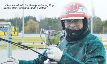  ??  ?? Chris Alford with the Traralgon Pacing Cup trophy after Hurricane Stride's victory