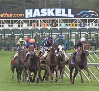  ?? PETER ACKERMAN, ASBURY PARK (N.J.) PRESS ?? Horses start a race at New Jersey’s Monmouth Park, which is hoping to offer sports gambling.