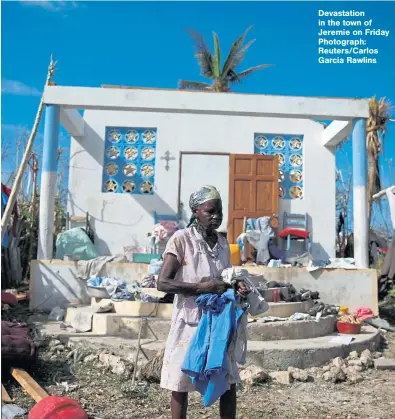  ??  ?? Devastatio­n in the town of Jeremie on Friday Photograph: Reuters/Carlos Garcia Rawlins