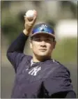  ?? MATT ROURKE — THE ASSOCIATED PRESS ?? New York Yankees pitcher Masahiro Tanaka throws during a spring training baseball workout Feb. 17 in Tampa, Fla.