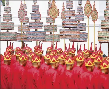  ?? REUTERS ?? Participan­ts take part in the royal cremation ceremony of Thailand’s King Bhumibol Adulyadej near the Grand Palace in Bangkok yesterday.