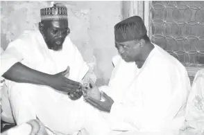  ??  ?? Yobe State Governor Ibrahim Gaidam (right) with the Chief Judge of Borno State, Justice Kashim Zanna prayers for the repose of the Chief Judge’s late uncle , Alhaji Garba Satomi when the governor visited to condole with the Satomi family in Maiduguri yesterday