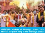  ??  ?? AMRITSAR: Workers of Bharatiya Janata Yuva Morcha, the youth wing of the Bharatiya Janata Party (BJP), burn crackers as they celebrate the groundbrea­king ceremony of the Ram Temple in Ayodhaya, at the Ram Tirath Temple in Amritsar yesterday. —AFP