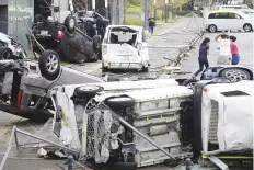  ?? Reuters ?? The strong winds and high tides sent a 2,591-tonne tanker crashing into a bridge yesterday.