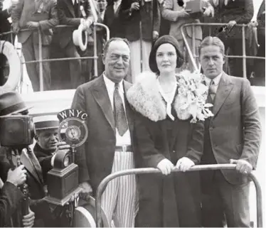 ??  ?? [Left] Bobby Jones’ father R.P., Bobby’s wife Mary and Bobby Jones on their return from the UK in 1930
[Below] Clifford Roberts and Jones at the Masters in 1954