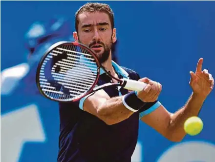  ?? AFP PIC ?? Marin Cilic in action against Stefan Kozlov in the Aegon Championsh­ips at Queen’s Club in London on Thursday.