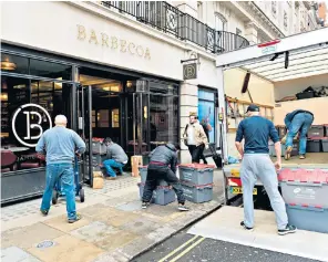  ??  ?? A Jamie Oliver Barbecoa restaurant closes in Piccadilly, London, last month, as high street eateries struggle
