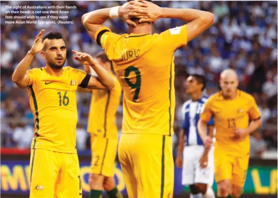  ??  ?? The sight of Australian­s with their hands on their heads is not one West Asian fans should wish to see if they want more Asian World Cup spots. (Reuters)