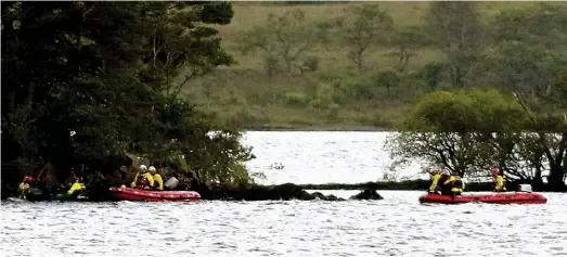  ??  ?? Search: Emergency workers scour Loch Awe at the weekend during a major operation trying to find the missing angler