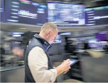  ?? REUTERS ?? A trader works on the floor at the New York Stock Exchange on March 7.