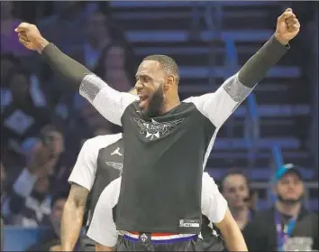  ?? Chuck Burton Associated Press ?? LeBRON JAMES captained his team to a comeback win in the All-Star game, and he’ll have to do the same with the Lakers in the second half of the season if he’s to reach the playoffs for the 14th straight season.