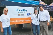  ??  ?? Price Rite employees volunteer at the “Feed the Children” event. From left, Kathy Freedman, Milly Delvalle and Bill Britton from the company’s human services department.