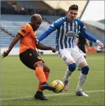  ??  ?? Kyle Lafferty (right) jostles for possession with Dundee United’s Jeando Fuchs