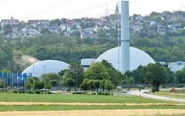  ?? BERND WEISSBROD/DPA ?? Germany is scheduled to shut down its last three operationa­l nuclear power plants, including this one at Neckarwest­heim in southern Germany, by year’s end.