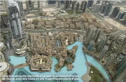  ??  ?? Une vue aérienne partielle d’un des quartiers d’affaires de Dubaï avec ses tours et ses magnifique­s plans d’eau.