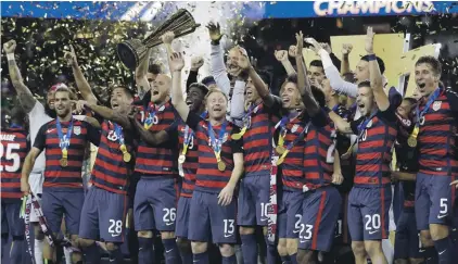  ??  ?? United States players celebrate after beating Jamaica 2-1 in the Gold Cup final Photo: AP