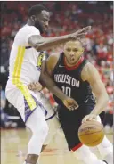  ?? The Associated Press ?? Houston Rockets guard Eric Gordon (10) drives around Draymond Green of the Golden State Warriors during Game 2 of their NBA Western Conference final on Wednesday in Houston.