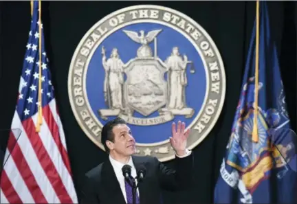  ?? HANS PENNINK — THE ASSOCIATED PRESS ?? New York Gov. Andrew Cuomo makes reference to his father Mario Cuomo as he delivers his state of the state address at the Empire State Plaza Convention Center on Wednesday in Albany, N.Y.
