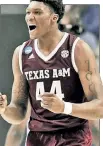  ?? Getty Images ?? UNC-YA LATER: Texas A&M’s Robert Williams is all pumped up during the Aggies’ blowout of UNC in Charlotte, N.C.