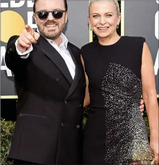  ??  ?? MAKING A POINT: Ricky Gervais and partner Jane Fallon at the awards