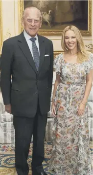  ??  ?? Prince Philip with singer Kylie Minogue, April 2017