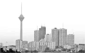  ?? — AFP photo ?? A view of the Iranian capital Tehran and its Milad Tower on May 9. A senior Iranian central bank official said conditions within the banking system had deteriorat­ed in the past year, and “we have still not passed the danger zone” but added that the...