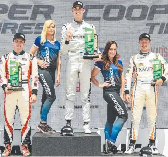  ?? Picture: Contribute­d ?? PODIUM FINISH: Toowoomba's Cameron Shields (right) celebrates his third place finish at the Road America round of the last year’s Road to Indy series.