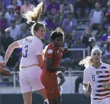  ?? Mike Comer/Getty Images ?? Samantha Mewis heads in one of five goals that the U.S. women’s team scored in a victory against Panama Sunday in Cary, N.C.