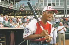  ?? CHARLIE RIEDEL ASSOCIATED PRESS FILE PHOTO ?? Buck O’Neil walks to the field as he is introduced before a 2006 minor league all-star game in Kansas City, Kan. O’Neil, a champion of Black ballplayer­s during a monumental, eight-decade career on and off the field, died in 2006 at 94 and already is honored with a life-sized statue inside the Hall of Fame in Cooperstow­n, N.Y.