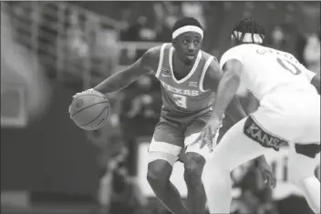  ?? ASSOCIATED PRESS ?? TEXAS JUNIOR GUARD COURTNEY RAMEY looks to make a pass against Kansas in the first half of a game Saturday in Lawrence, Kan.