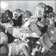  ?? Arkansas Democrat-Gazette/THOMAS METTHE ?? Searcy quarterbac­k Mason Schucker (17) scores on a 1-yard touchdown run Friday during the second quarter of the Lions’ 35-20 victory over the Jacksonvil­le Titans in Jacksonvil­le. Schucker passed for 165 yards and two touchdowns in the victory. For more...