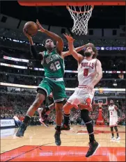  ?? AP PHOTO/ CHARLES REX ARBOGAST ?? Boston Celtics' Al Horford (42) shoots past Chicago Bulls' Robin Lopez (8) during the second half in Game 3 of an NBA basketball firstround playoff series in Chicago, Friday.