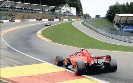  ?? PICTURE: REUTERS ?? ROUND THE BEND: Ferrari’s Kimi Raikkonen in action during yesterday’s practice session for tomorrow’s Belgian Grand Prix at Spa-Francorcha­mps.